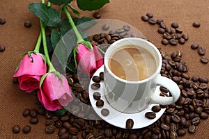 Pink rose black coffe cup and coffee beans