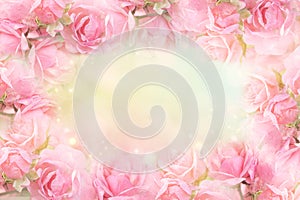 Pink rose flower frame on soft bokeh vintage background for valentine