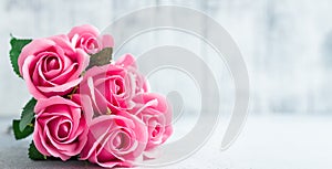 Pink rose flowers bouquet on white wooden background Beautiful flowers