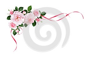Pink rose flowers and silk waved ribbons in a corner arrangement photo