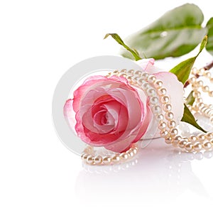 Pink rose and pearl beads.