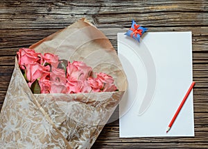 Pink roses with blank paper and colored pencil