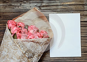 Pink roses with blank paper and colored pencil