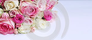 Pink roses in a festive bouquet on a white background. Delicate floral arrangement.