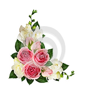 Pink roses and freesia flowers and buds in a corner arrangement