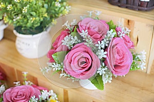 Pink roses gentle bouquet in a white vase.