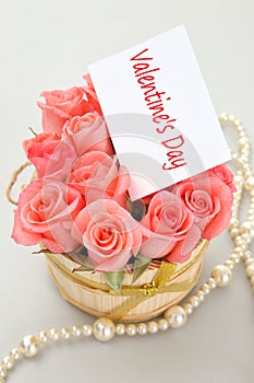 Pink roses with note paper for valentine's day