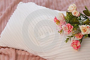 Pink roses on pillow, flowers on bed, lifestyle romantic staging