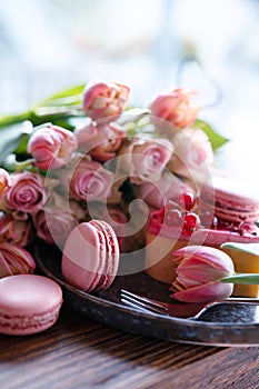 Pink roses and sweet pastrys