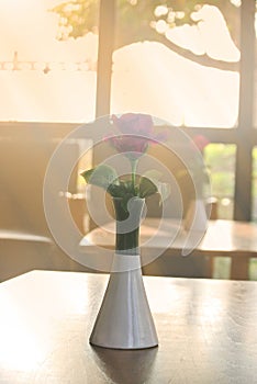 Pink roses on the table, the concept of love and hearts on Valentine& x27;s Day.