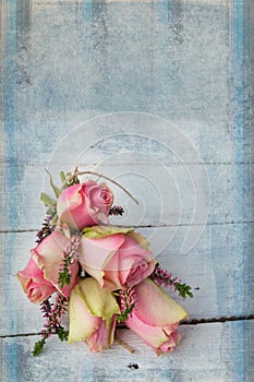 Pink roses on textured table