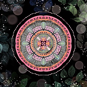 Pink round mandala with black background.