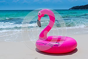 Pink rubber life ring on the beach
