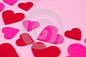 Pink Saint Valentine`s day background with red and pink hearts, soft focus, copy space