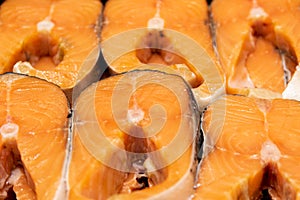 Pink salmon steaks shot close-up. Red sea fish in butchered form