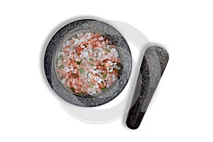 Pink salt with bay leaf in granite mortar with pestle