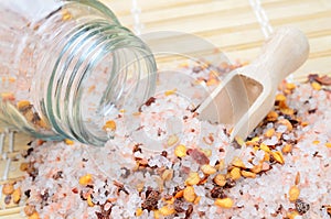 Pink salt with chili seed on table