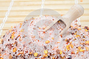 Pink salt with chili seed on table