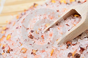 Pink salt with chili seed on table