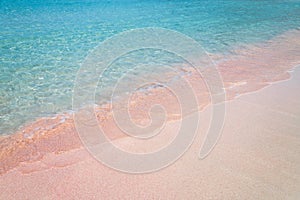 Pink sand and turquoise pristine water one Balos beach in Crete, Greece