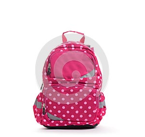 Pink school backpack with white dots isolated on white