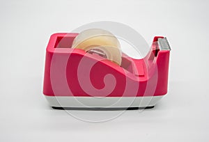 Pink Sellotape scotch tape dispenser isolated on white