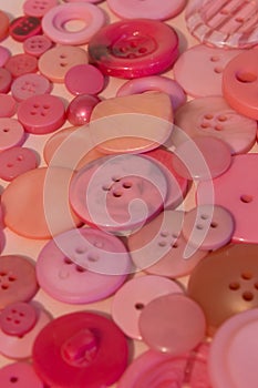 Pink sewing buttons background