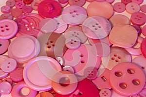 Pink sewing buttons background