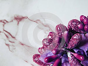 Pink shiny dry decoration ornamentals on marble background