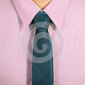 Pink shirt with dark blue necktie