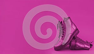 Pink shoes on a pink background. Leather shoe banner. Stylish boot. Boots. Winter and spring off-season boots. Stylish boot