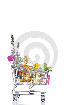 Pink Shopping trolley with pills and medicine