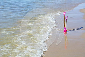 Pink shovel in the sand