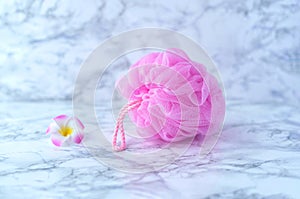 Pink shower sponge. Washcloth made of synthetic mesh