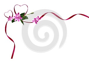 Pink silk ribbon hearts and small flowers for Valentine`s day