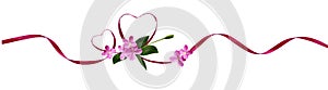 Pink silk ribbon hearts and small flowers for Valentine`s day