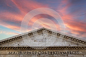 Pink skies over Pantheon roman temple and catholic church in rome Italy.