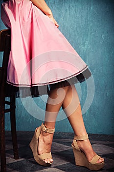 Pink skirt and wedge high heel shoes