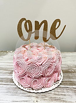 Pink smash cake for one year old birthday party