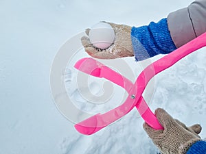 pink snowball maker make balls out of snow.