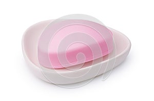 Pink soap bar in ceramic soap dish