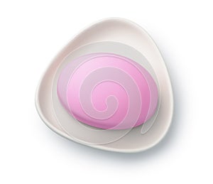 Pink soap bar in ceramic soap dish