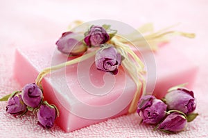 Pink soap with dried roses