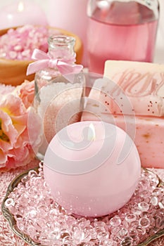 Pink spa set: scented candle, bath caviar, bar of soap and liquid soap