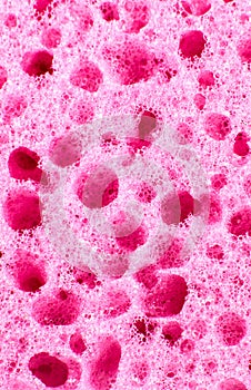Pink sponge texture background. Close up, macro photo