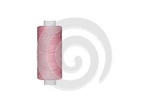 pink spool of sewing thread isolated on white background