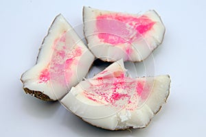 Pink spots on coconut. Coconut turned pink after opening because of polyphenol oxidase or microbial attack, which that lead to the