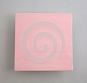 Pink square on a gray acrylic primed canvas photo