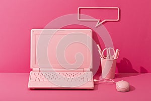 Pink stationery and pink laptop on pink background, barbie concept style