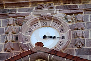 Pink stone clock of church of San Lorenzo of Ziga photo